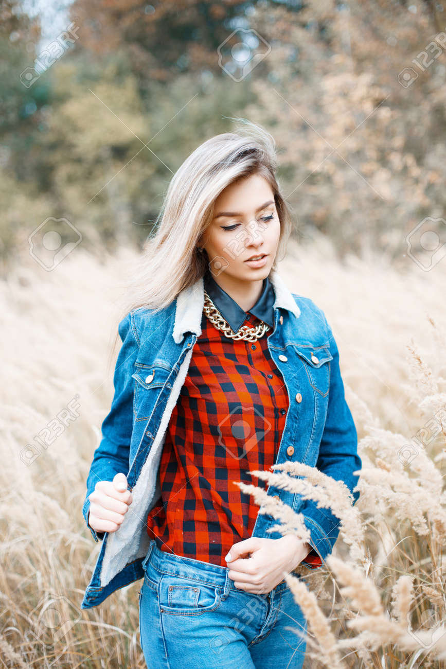 47804015-beautiful-stylish-girl-in-denim-jacket-checkered-red-shirt-and-blue-jeans-.jpg